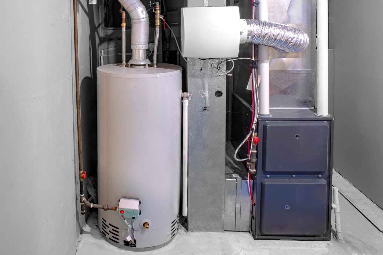 A home high efficiency oil furnace with a residential gas water heater.