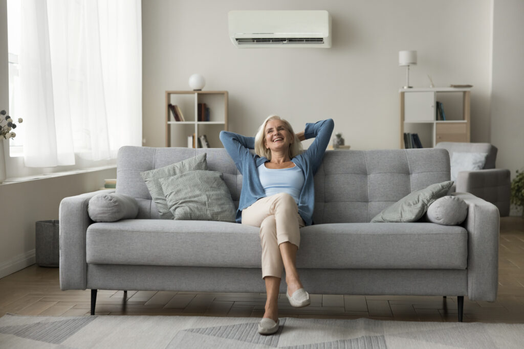 Senior Woman in Living Room with Ductless Mini Split