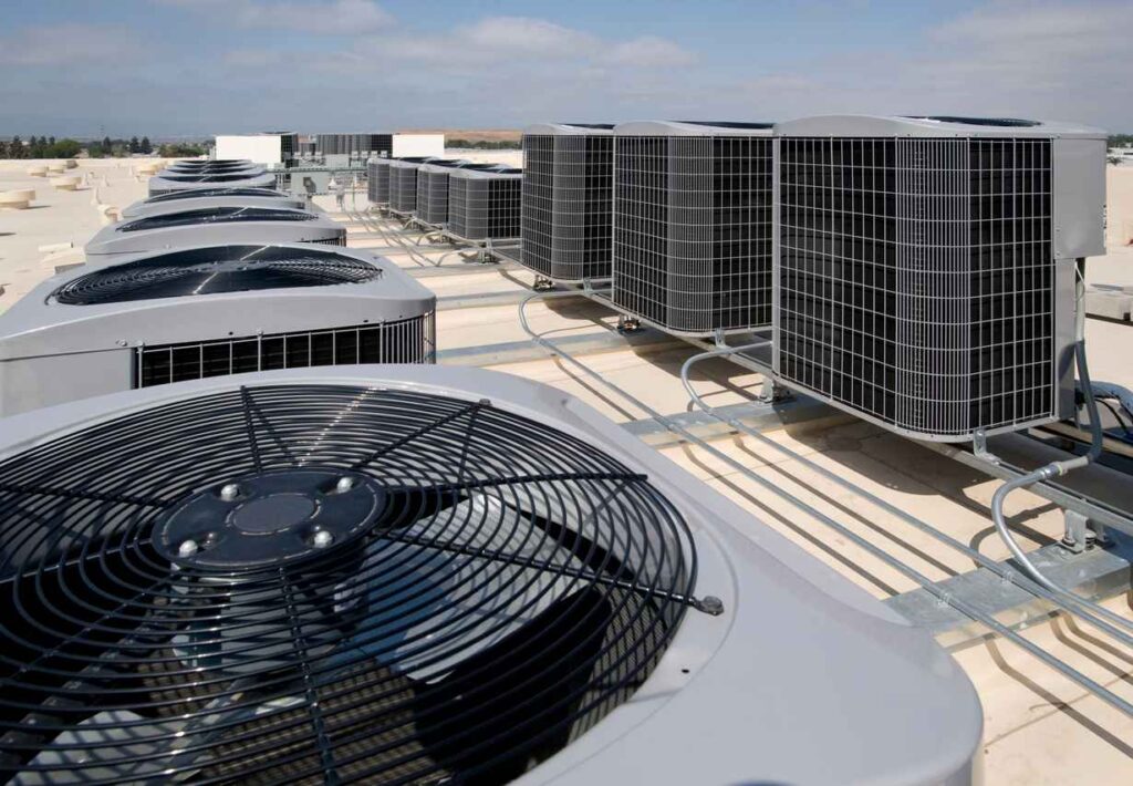 Air conditioning condensers on the roof of a large building.