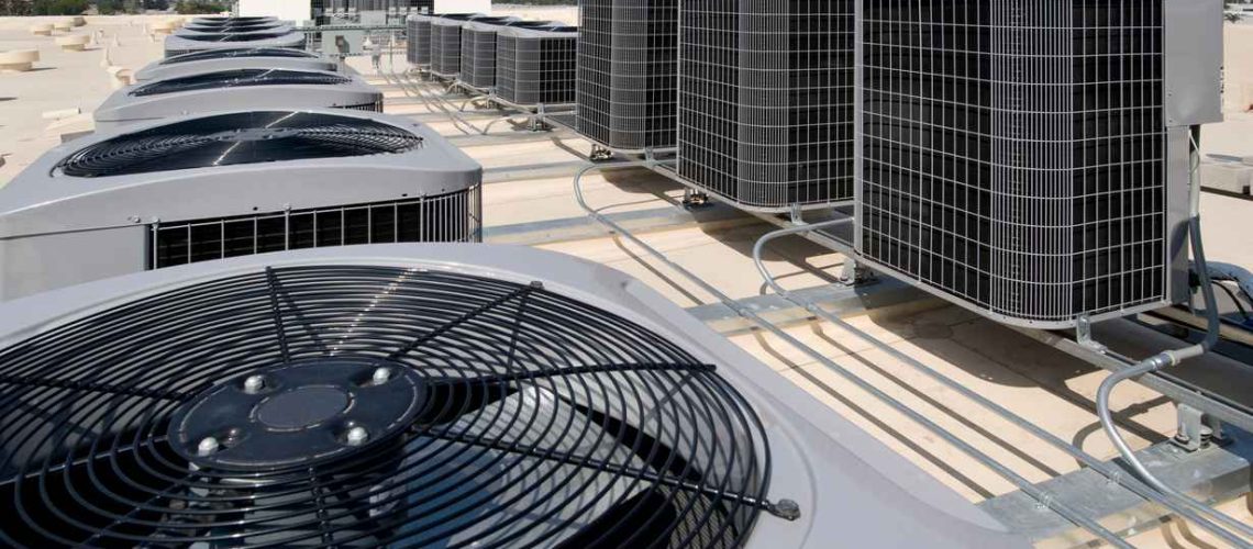 Air conditioning condensers on the roof of a large building.